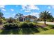 Landscaped front yard of a one-story home at 2705 Lamkin Rd, North Port, FL 34288