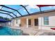 Covered patio and pool area with access to house at 2705 Lamkin Rd, North Port, FL 34288