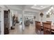 Bright dining room with hardwood floors and view into the living room at 2705 Lamkin Rd, North Port, FL 34288