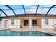 Covered patio and pool area with access to house at 2705 Lamkin Rd, North Port, FL 34288