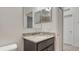 Bathroom featuring granite vanity and tiled shower at 2705 Lamkin Rd, North Port, FL 34288