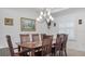 Elegant dining room with wood table and chandelier at 2705 Lamkin Rd, North Port, FL 34288