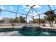 Screened pool and spa with tiled accents at 2705 Lamkin Rd, North Port, FL 34288