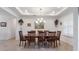 Spacious dining room with wood table and chandelier at 2705 Lamkin Rd, North Port, FL 34288