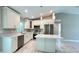 Modern kitchen featuring stainless steel appliances and an island at 3832 Vehlin St, North Port, FL 34286