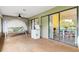 Relaxing screened porch with a swing, view into dining room at 4290 Randypaar St, Port Charlotte, FL 33948