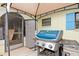 Outdoor patio with gas grill and storage shed at 4290 Randypaar St, Port Charlotte, FL 33948