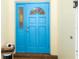 Bright blue front door welcomes you into the home at 4290 Randypaar St, Port Charlotte, FL 33948