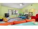 Open living room with colorful furniture and wood-look floors at 4290 Randypaar St, Port Charlotte, FL 33948