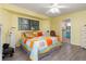 Main bedroom with a king-size bed, dresser, and ceiling fan at 4290 Randypaar St, Port Charlotte, FL 33948