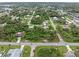 Aerial view of residential neighborhood, showcasing properties and surrounding landscape at 4290 Randypaar St, Port Charlotte, FL 33948