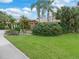 House with lush landscaping, pergola, and spacious yard at 4290 Randypaar St, Port Charlotte, FL 33948