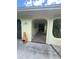 Covered porch and garage featuring a charming architectural archway and stucco exterior at 4290 Randypaar St, Port Charlotte, FL 33948