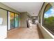 Covered porch with access to backyard, view of kitchen and backyard at 4290 Randypaar St, Port Charlotte, FL 33948