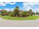 Charming single story home with lush landscaping and spacious front yard at 4290 Randypaar St, Port Charlotte, FL 33948