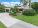 Ranch-style home with pergola and lush landscaping at 4290 Randypaar St, Port Charlotte, FL 33948