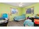 Bright bedroom with twin beds and wood-look flooring at 4290 Randypaar St, Port Charlotte, FL 33948