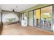 Relaxing covered patio featuring a swing, ceiling fan, and views of the indoor dining area at 4290 Randypaar St, Port Charlotte, FL 33948