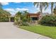 A charming house with a pergola and lush landscaping at 4290 Randypaar St, Port Charlotte, FL 33948