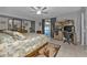 Bedroom featuring a comfortable bed, a dedicated workspace, and sliding doors to the pool area at 5198 White Ave, Port Charlotte, FL 33981