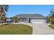 Inviting single-story home with a two-car garage, RV parking and well maintained landscaping at 5198 White Ave, Port Charlotte, FL 33981