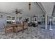 Relaxing patio area with dining furniture and ceiling fans at 5198 White Ave, Port Charlotte, FL 33981