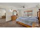 Main bedroom with large dresser and sliding doors at 5950 Cypress Grove Cir, Punta Gorda, FL 33982