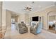 Relaxing living room featuring a large TV and comfortable seating at 120 Cordana Ct, Venice, FL 34292