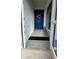 Blue front door with wreath, leading to home at 1370 Kenmore St, Port Charlotte, FL 33952