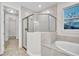 Bathroom with a large walk-in shower and garden tub at 16138 Highgate St, Port Charlotte, FL 33953