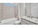 Simple bathroom with a tub, toilet, and granite countertop at 16138 Highgate St, Port Charlotte, FL 33953
