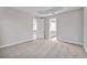 Spacious bedroom with neutral carpeting and en-suite bathroom access at 16138 Highgate St, Port Charlotte, FL 33953