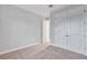 Bedroom with neutral walls and carpet, double door closet at 16138 Highgate St, Port Charlotte, FL 33953