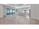 Open kitchen with island, stainless steel appliances, and gray cabinets at 16138 Highgate St, Port Charlotte, FL 33953