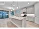 Open kitchen with island, stainless steel appliances, and granite countertops at 16138 Highgate St, Port Charlotte, FL 33953