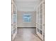 Spacious office with French doors and wood-look tile flooring at 16138 Highgate St, Port Charlotte, FL 33953