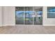 Sliding glass doors leading to a backyard patio and grass at 16138 Highgate St, Port Charlotte, FL 33953