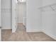 Spacious walk-in closet with ample shelving and hanging space at 16138 Highgate St, Port Charlotte, FL 33953