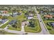 Aerial view of the property highlighting the surrounding neighborhood and proximity to the street at 182 Santarem Cir, Punta Gorda, FL 33983