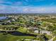 Community aerial view showcasing the golf course and surrounding residential area at 182 Santarem Cir, Punta Gorda, FL 33983