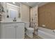 Bathroom featuring a vanity with white cabinetry, a toilet, and a tub with a butterfly shower curtain at 182 Santarem Cir, Punta Gorda, FL 33983