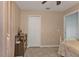 Bedroom featuring a beige wall, closet, side table and white metal frame bed at 182 Santarem Cir, Punta Gorda, FL 33983