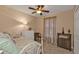 Bedroom featuring a metal frame bed, neutral tones, and a cozy atmosphere with natural light at 182 Santarem Cir, Punta Gorda, FL 33983