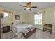 Cozy bedroom featuring neutral walls, tile flooring, and a serene atmosphere at 182 Santarem Cir, Punta Gorda, FL 33983