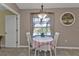 Charming breakfast nook with a view overlooking the backyard pond through a large window at 182 Santarem Cir, Punta Gorda, FL 33983