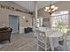 Elegant dining room with chandelier, ample natural light, and a cozy atmosphere at 182 Santarem Cir, Punta Gorda, FL 33983