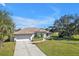 Charming home with a spacious driveway, mature landscaping, and great curb appeal at 182 Santarem Cir, Punta Gorda, FL 33983