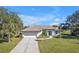 Well-maintained home with lush landscaping, a spacious driveway, and curb appeal at 182 Santarem Cir, Punta Gorda, FL 33983