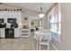 Kitchen area with view of a breakfast nook and bedroom beyond at 182 Santarem Cir, Punta Gorda, FL 33983
