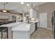 Spacious kitchen with white countertops, neutral cabinets, and a breakfast bar seating area at 182 Santarem Cir, Punta Gorda, FL 33983